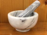 large white marble mortar and pestle